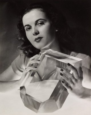 AGNSW collection John Lee Studio June Prior photographed with a perspex scaled model of a perfect sugar crystal 1948