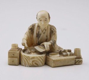 Figure of a man preparing food (okimono), 19th century by Shizukuni