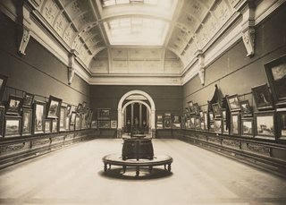 Walter Liberty Vernon’s long gallery hung entirely with watercolours around the time it opened in 1901. Image from Art Gallery of NSW Archive